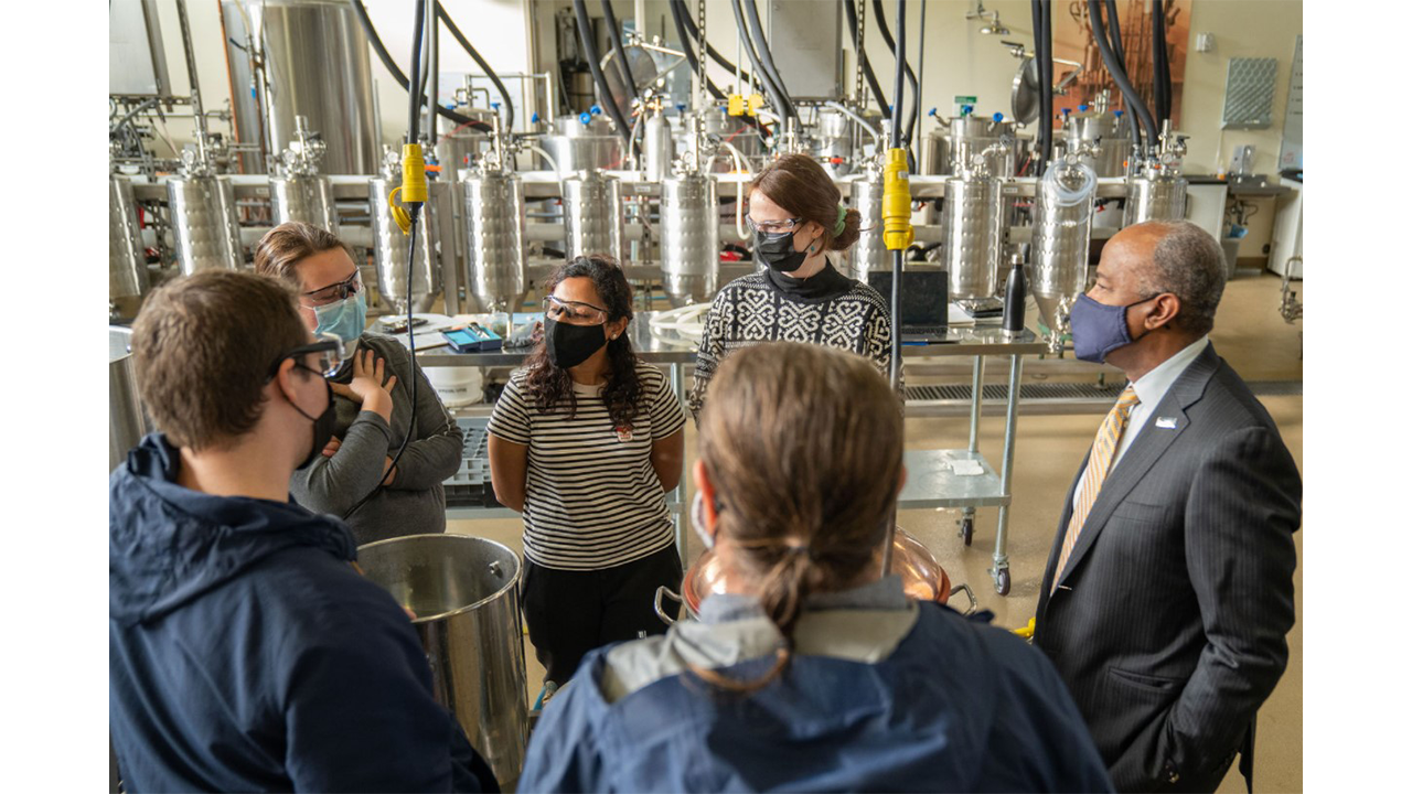 image of Chancellor in brewery with students