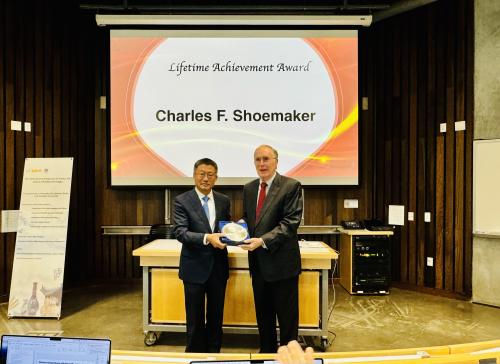 Charles Shoemaker receving the Lifetime Achievement Award from President Wei Chen