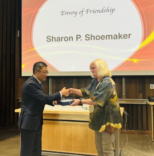 Sharon Shoemaker receving the Envoy of Friendship Award from President Wei Chen